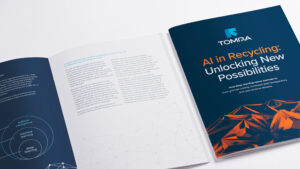 Open and closed views of Tomra’s eBook on AI in recycling, placed on a white background.